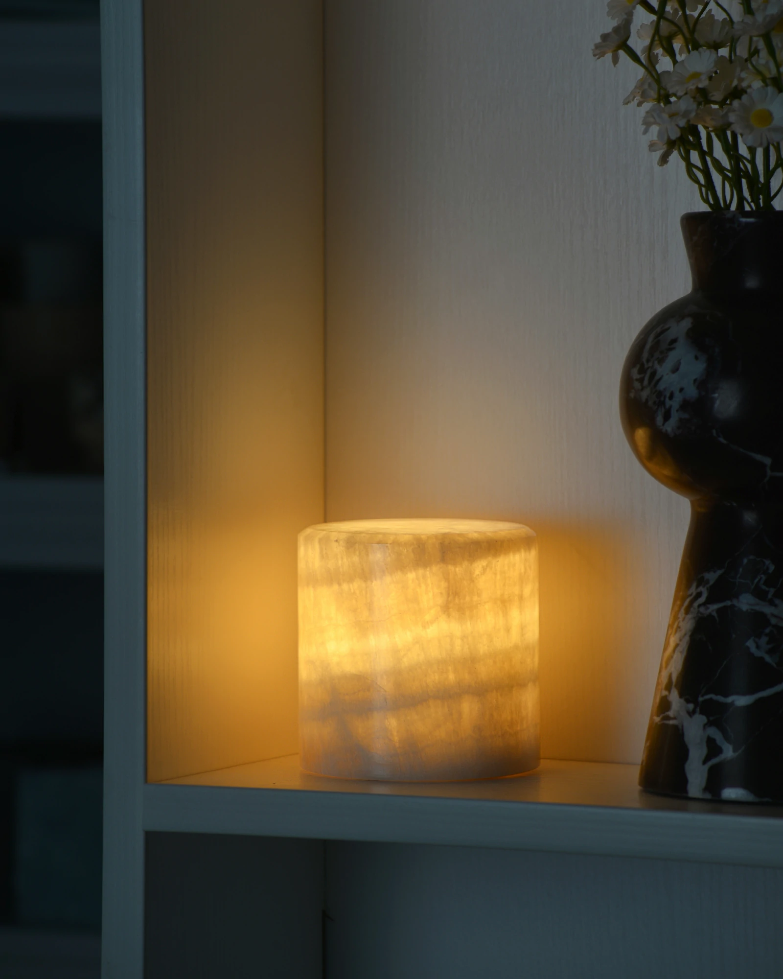 Mini Yellow Onyx Lamp glowing in dark room corner