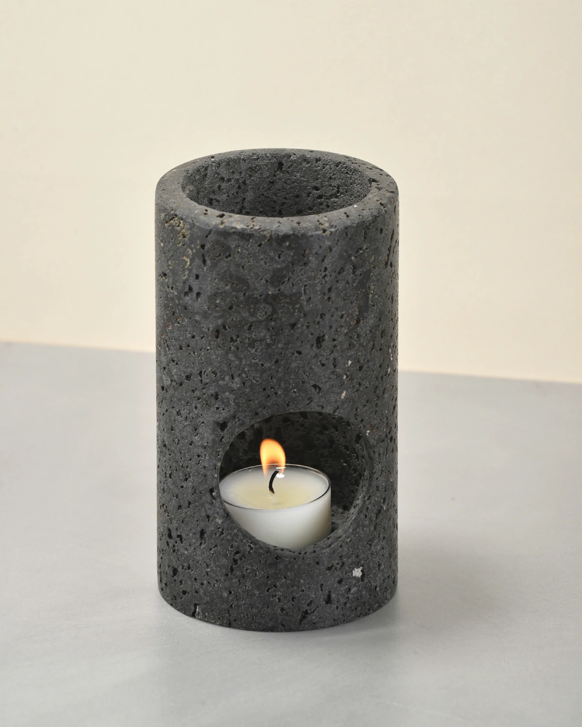 Black Travertine Candle Holder at 45-degree angle showing cylindrical form