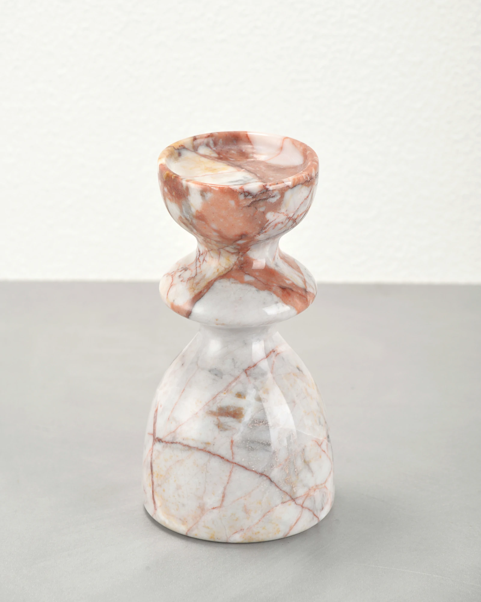 Vintage red marble candle holder at 45-degree angle