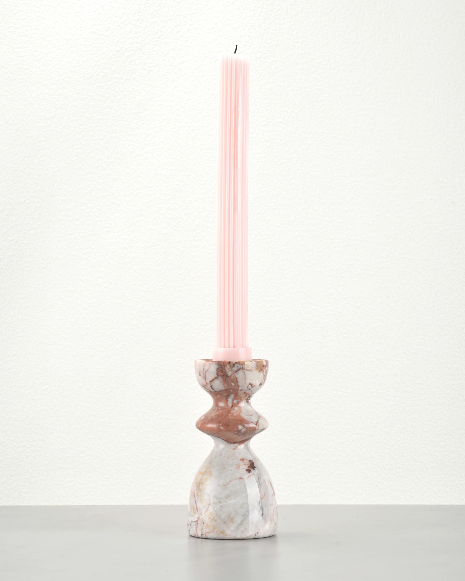 Vintage red marble candle holder styled with a taper candle