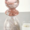 Close-up of natural veining on vintage red marble candle holder