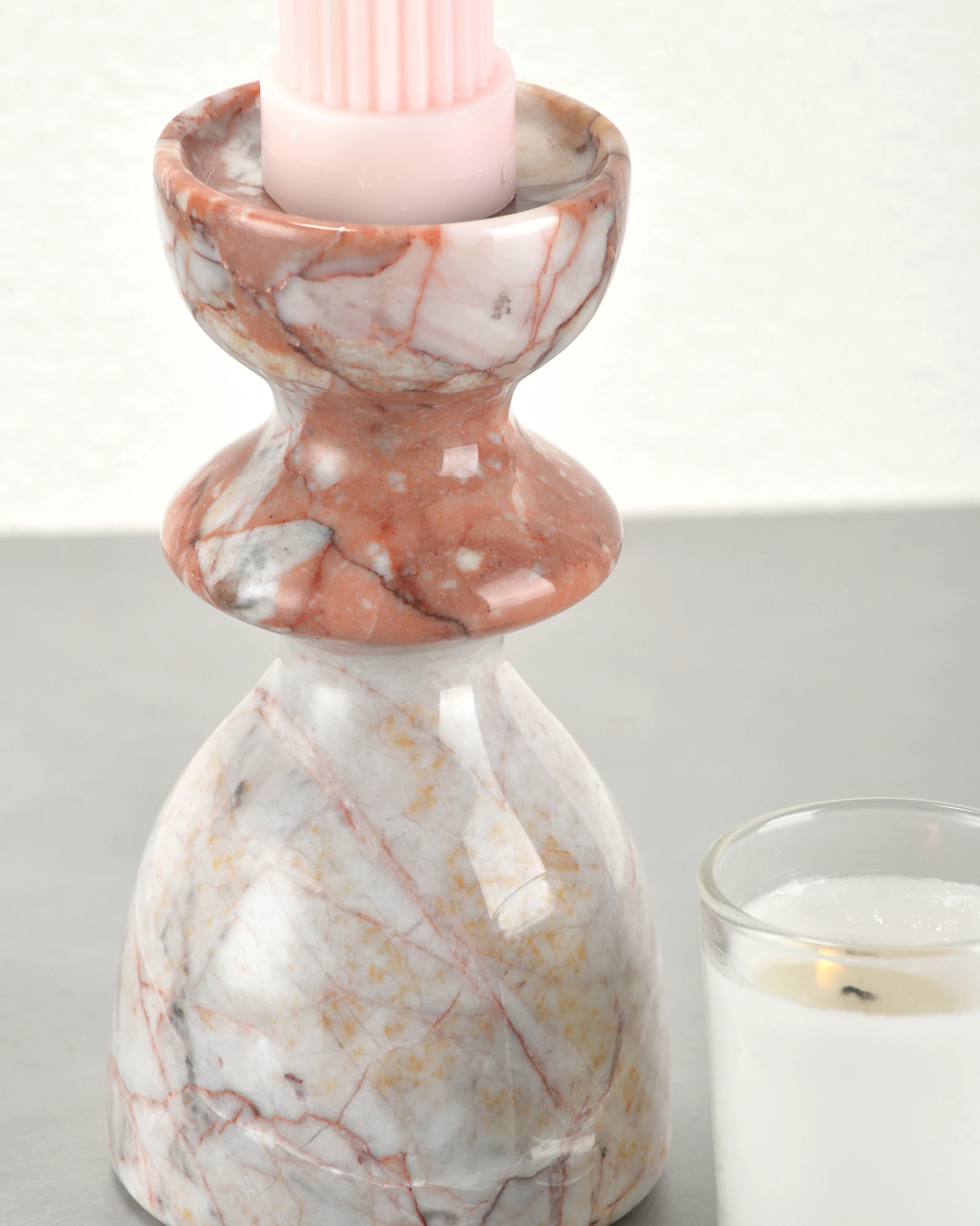 Close-up of natural veining on vintage red marble candle holder