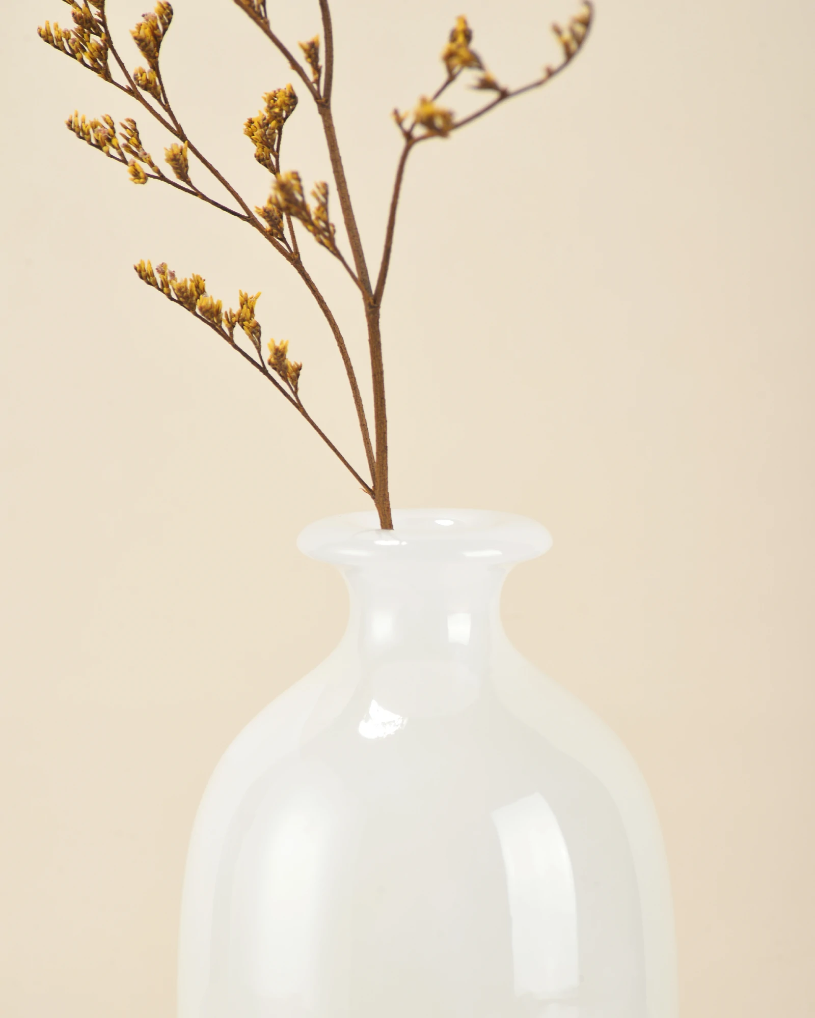 Mini White Onyx Vase front close-up with flowers showing graceful curved rim