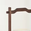 Close-up of walnut handle on portable white onyx lamp