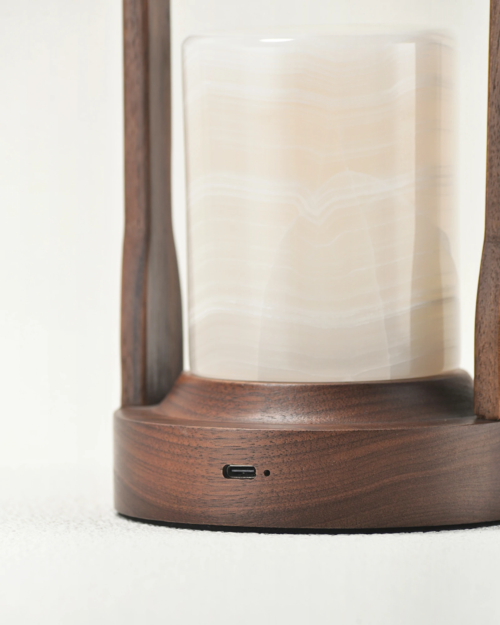 Charging port on portable white onyx lamp base