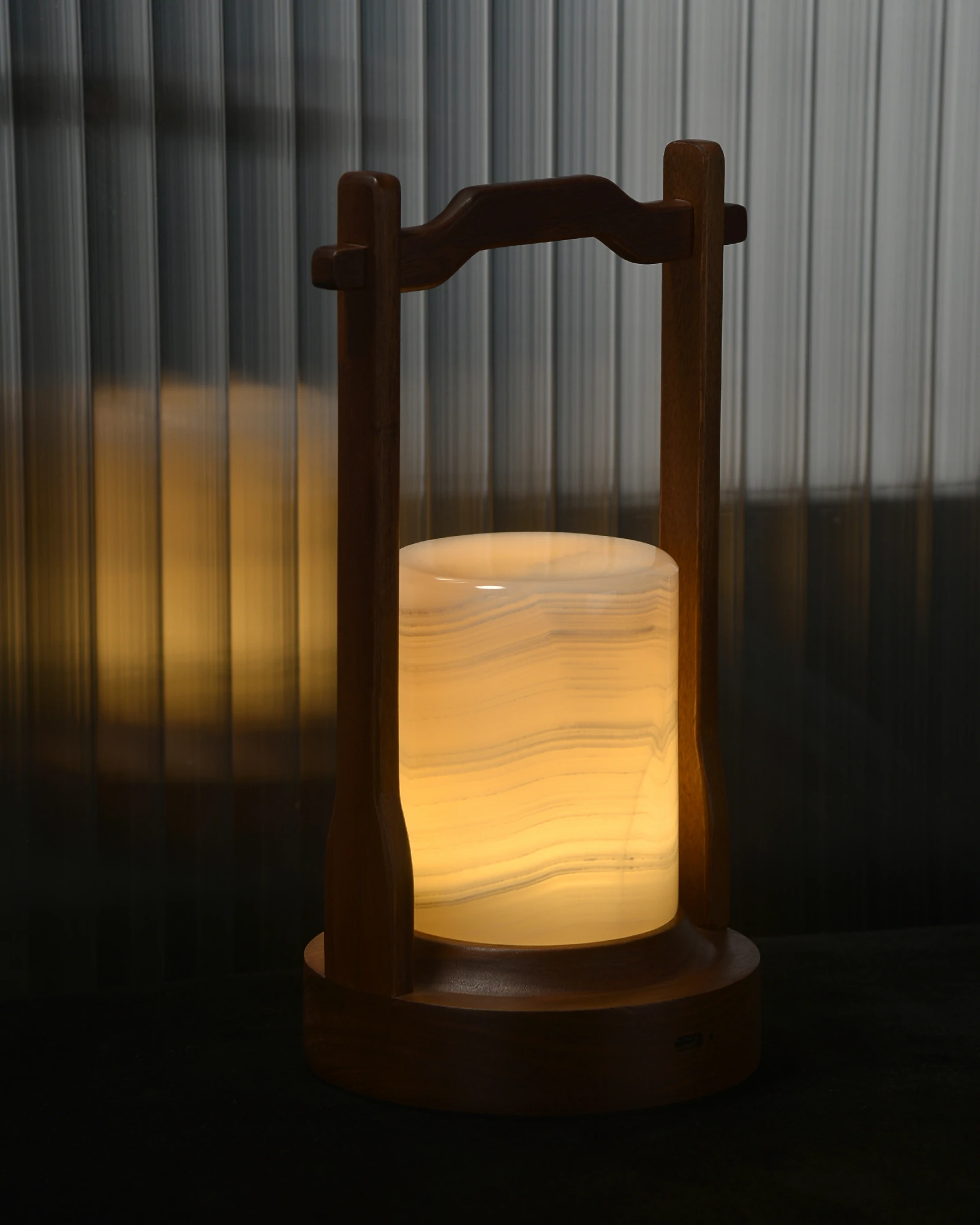Close-up of glowing white onyx lamp showing unique natural veins