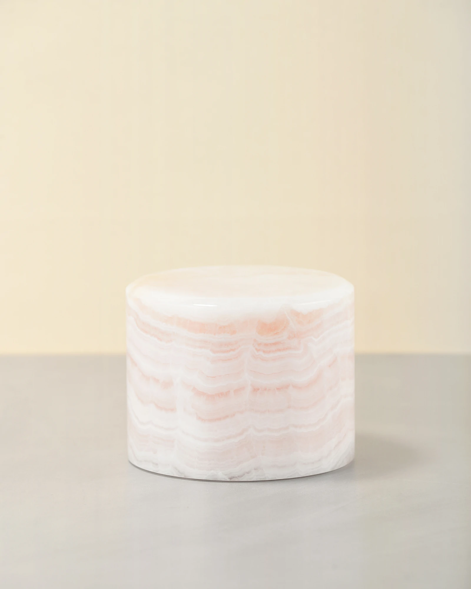 Mini pink onyx table lamp 45-degree view in soft light pink shade