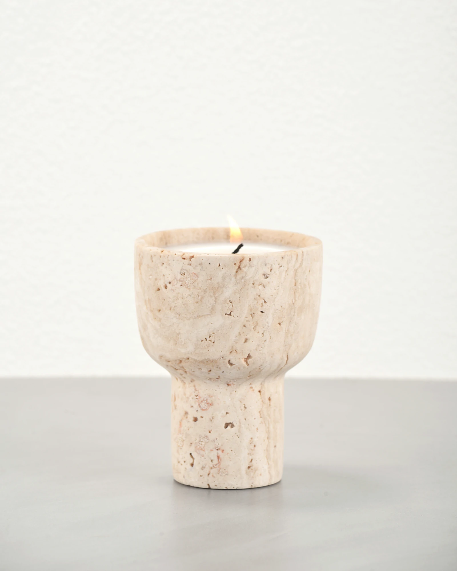 Travertine scented candle holder at 45-degree angle