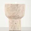 Close-up front view of travertine scented candle holder