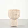 Travertine candle holder showing natural pores at 45-degree angle