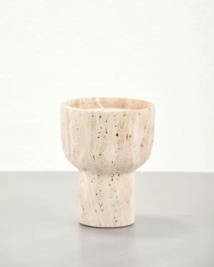 Travertine candle holder showing natural pores at 45-degree angle