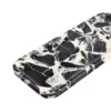 Angled view of the Bvlgari Black marble tray, Piece B, showing the polished rim and rounded corners.