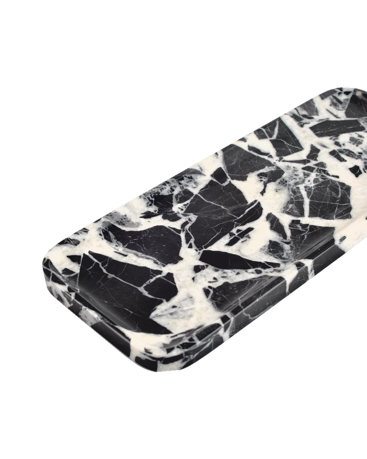 Angled view of the Bvlgari Black marble tray, Piece B, showing the polished rim and rounded corners.