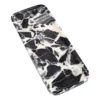 Three-quarter view of the Bvlgari Black marble tray, Piece B, showing its shallow profile and stone pattern.