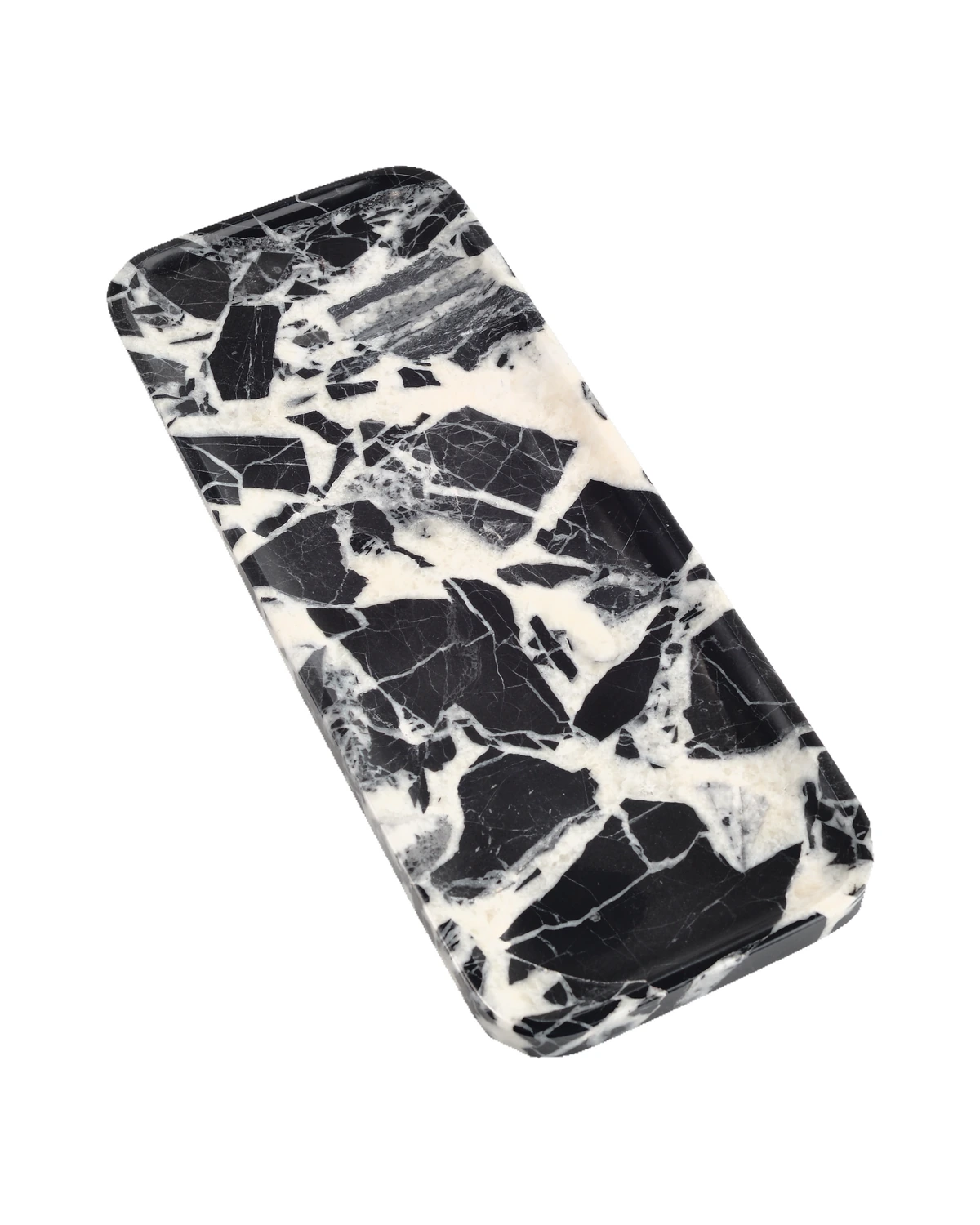 Three-quarter view of the Bvlgari Black marble tray, Piece B, showing its shallow profile and stone pattern.