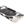 Angled view of the Bvlgari Black marble tray, Piece C, showing the polished edge and natural pattern.