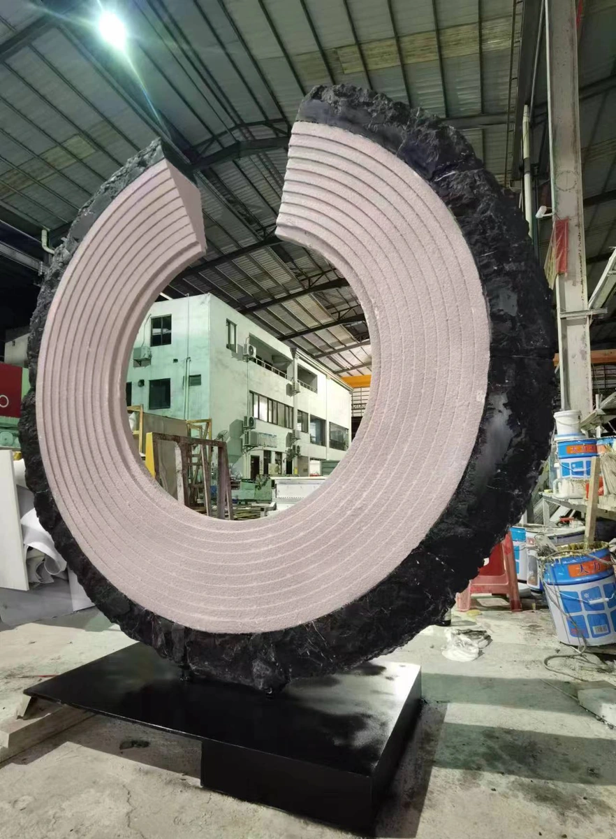 Factory trial assembly of a non-closed C-shaped marble sculpture