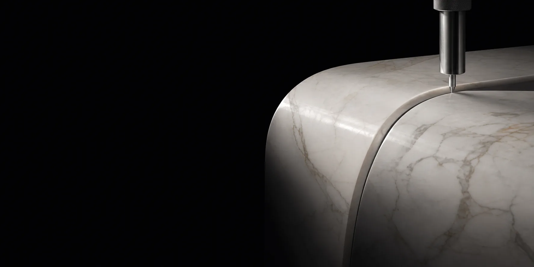 Abstract precision shaping of a curved natural stone surface.