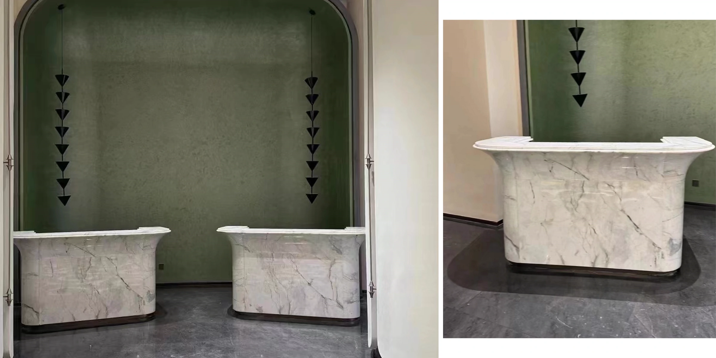 Two completed curved Fish Belly White marble reception counters in the finished interior.