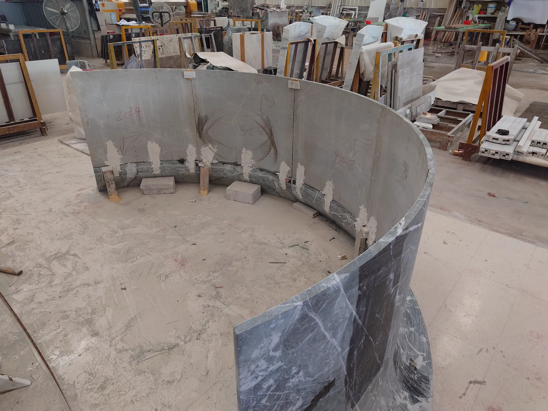 Reverse view of Prada Green marble counter components during trial assembly.