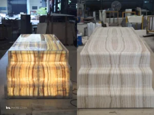 A completed custom backlit marble dining table showing the finished stonework and integrated lighting.