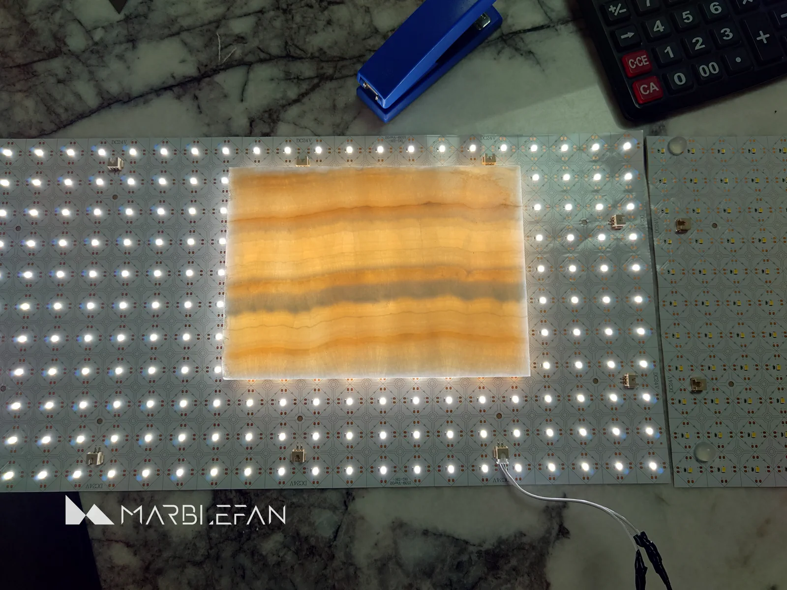 Translucent marble sample during a workshop lighting test.