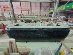 Completed 3.6-metre Big Flower Green marble reception desk in the factory