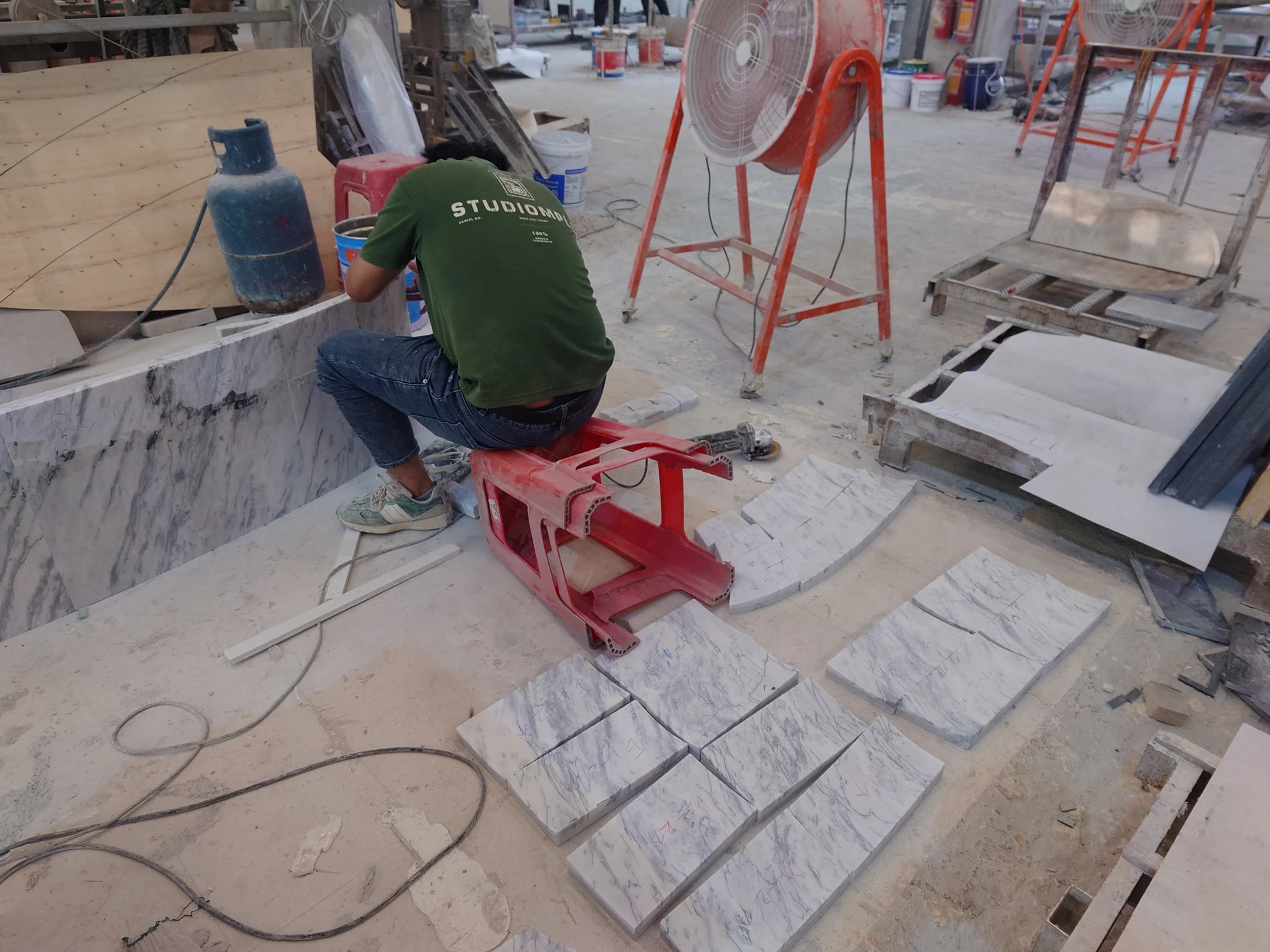 Carved marble components prepared for reception desk assembly